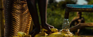 local person at a waterpump