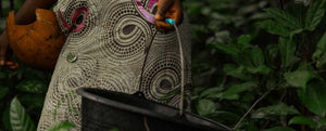 a woman holding a bucket